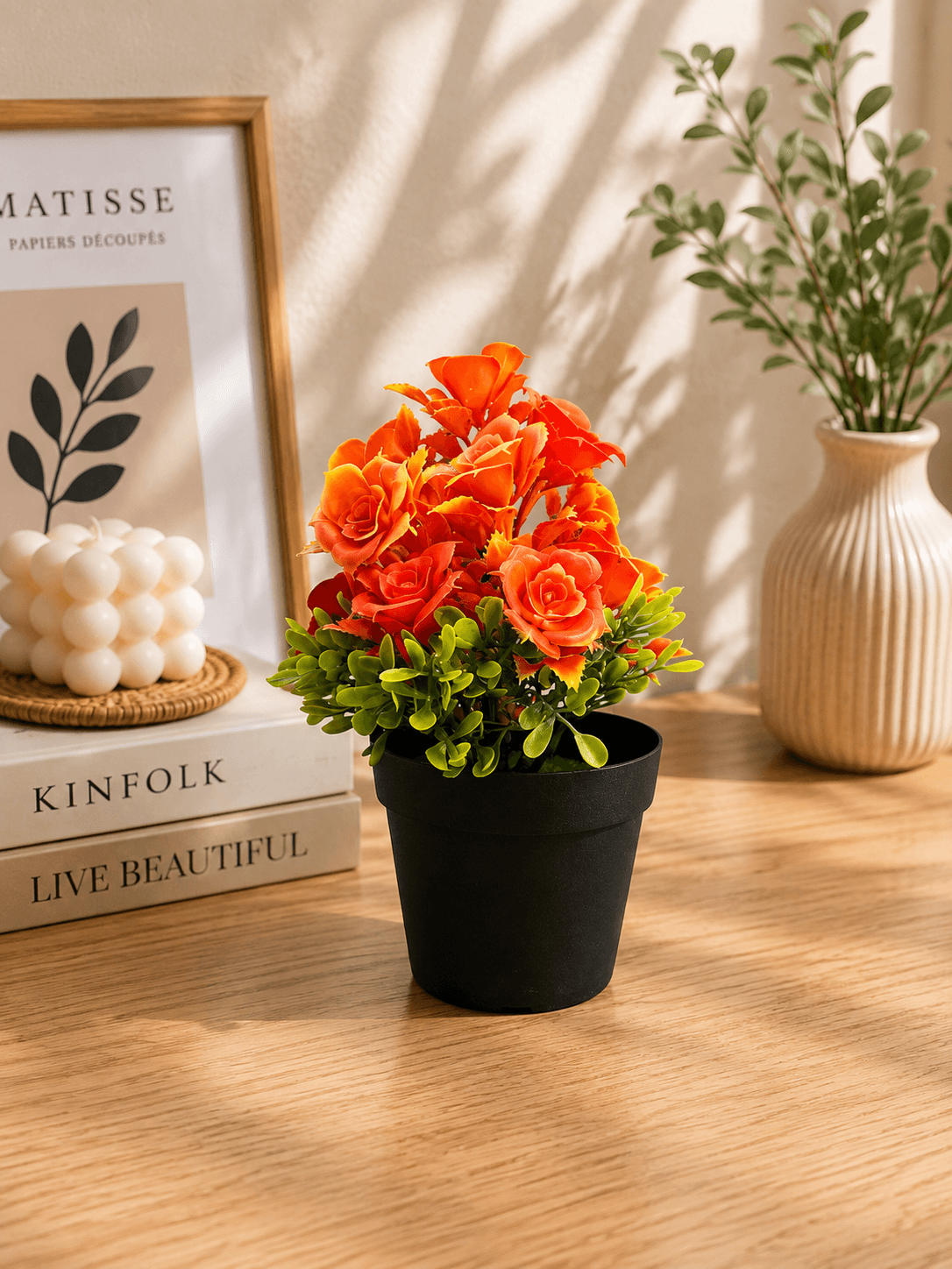 Artificial Orange Rose Flower Arrangement with Green Leaves in Black Pot(pack of 1)